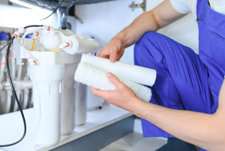 Technician changing air filter to ensure airflow, replace every 1–3 months to avoid clogs.