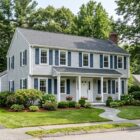 1970s colonial home in Chelmsford MA with fresh exterior paint and maintained siding